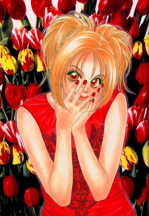 Девушка в красном платье на фоне тюльпанов